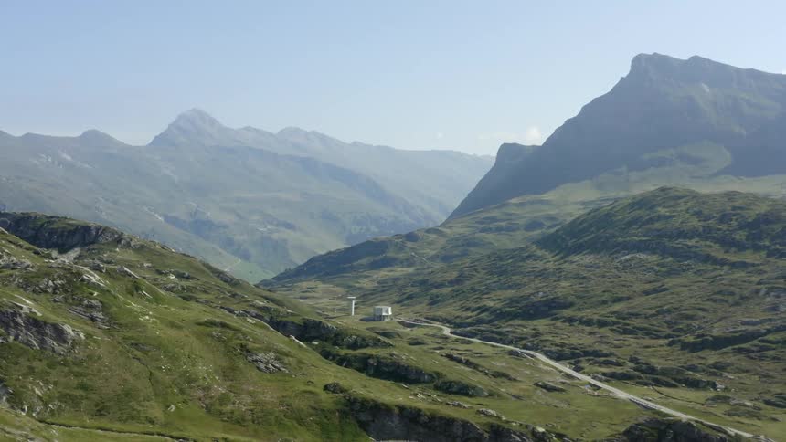 A landscape view of mountains on a summer day