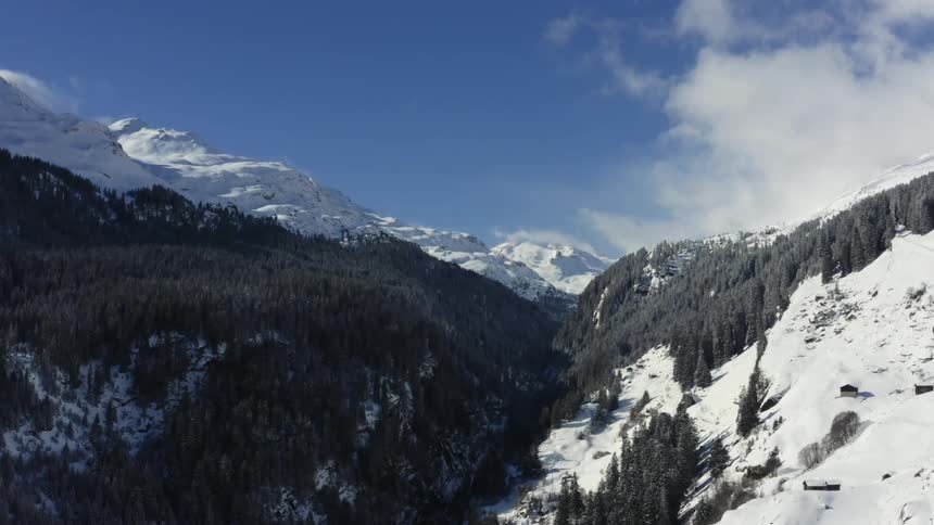 Aerial view of snow covered mountains are displayed during the day