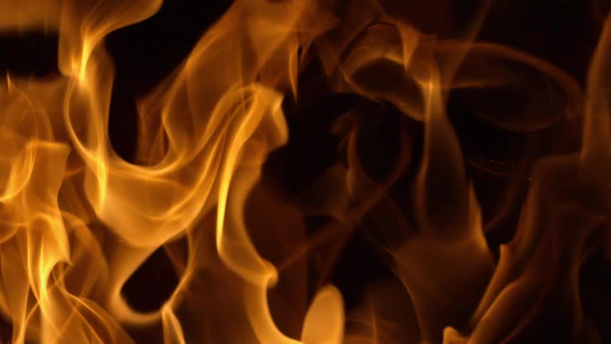 A bonfire is displayed at night