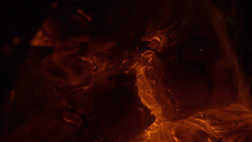 Extreme close up of glowing red hot embers burning