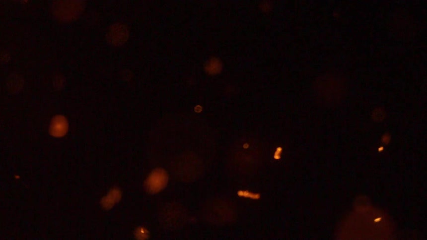 Embers floating through darkness