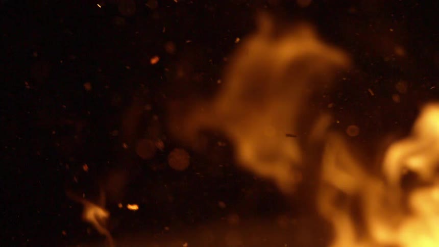 Flames against a brown and black background with embers