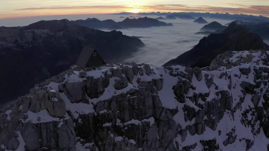 Aerial view of mountains at dusk is displayed