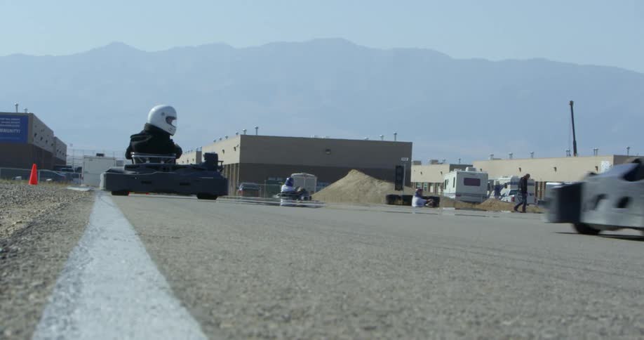 A group go karting around a track