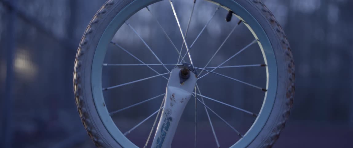 White bicycle wheel spins
