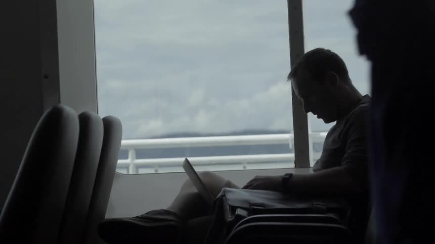 A person looks at their laptop