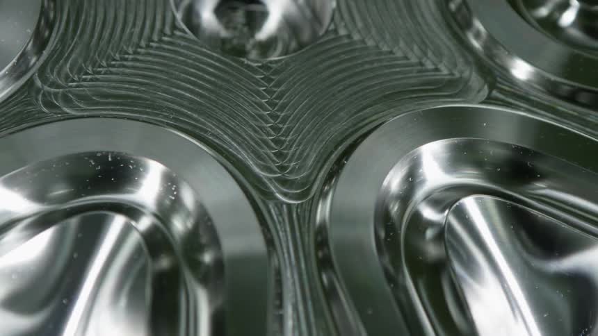 Blurry metallic to clear close up of metal chrome with shape and texture