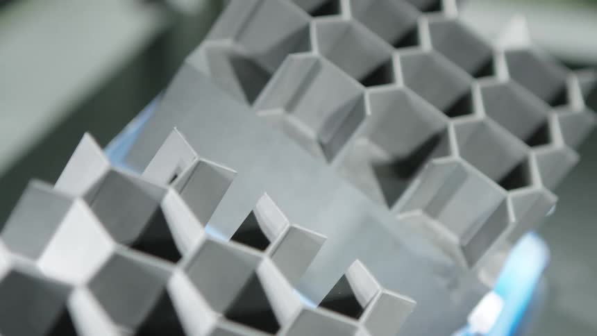 Hexagonal shapes are connected together to form a honeycomb pattern