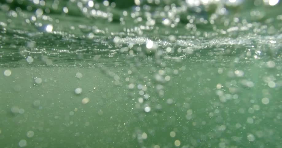 Bubbles rising to the surface of the ocean
