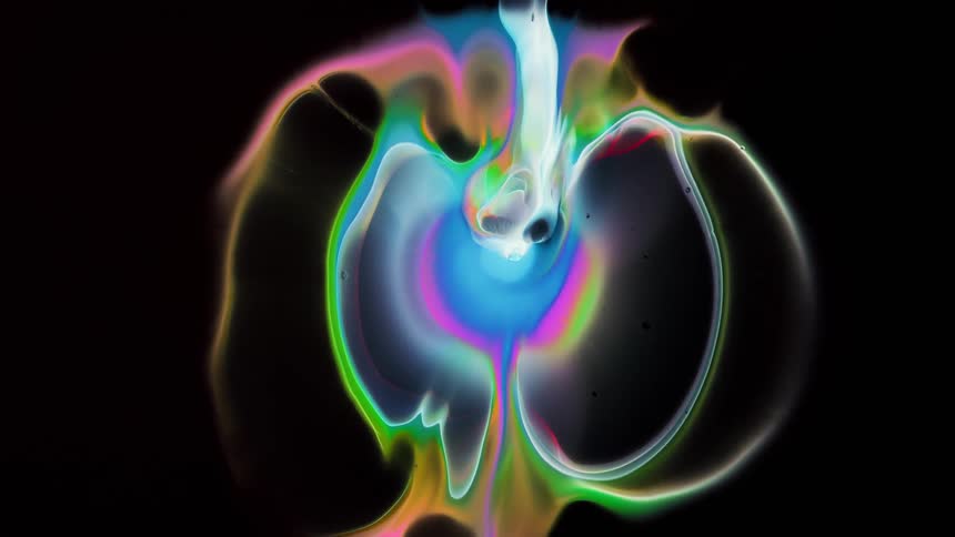Psychedelic colorful ink spreading blooming