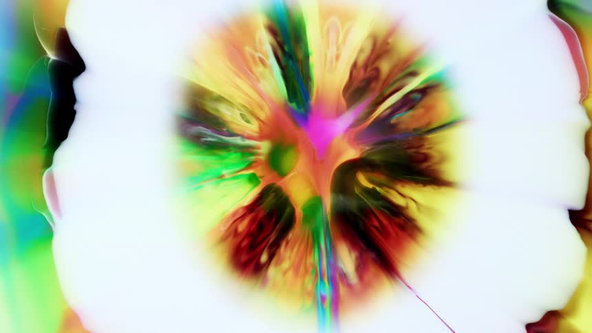 An abstract kaleidoscopic puddle of colors swirled into pale yellow expand and contract into flowerlike shapes in front of a white background