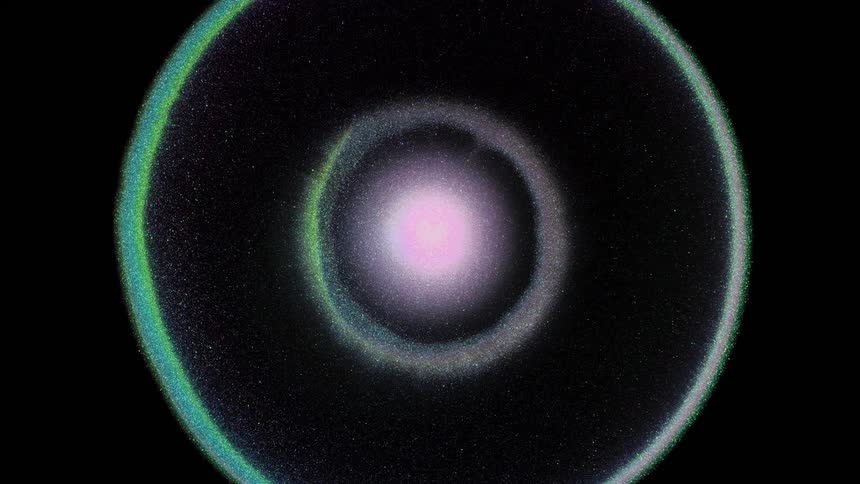 A drop of colors and glitter explodes in the shape of a ring
