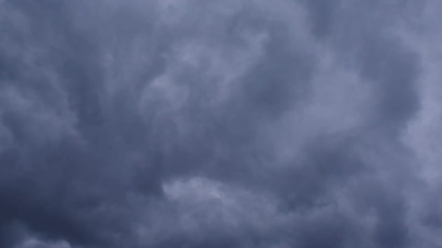 Time lapse of purple and blue storm clouds swirling and boiling in this straight up at the sky high intensity shot