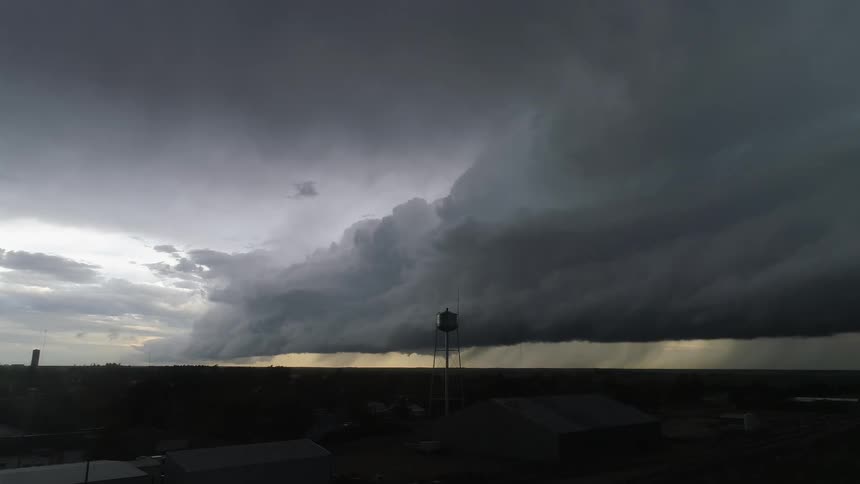 Wide real time shot of a massive wall cloud barreling across eastern Colorado as the severe thunderstorm approaches the camera