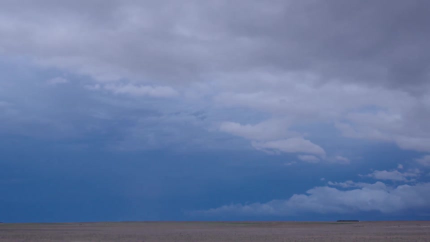 Time lapse of a severe thunderstorm blowing east away from the camera as the storm clears the area and the sun sets to a dark blue tone
