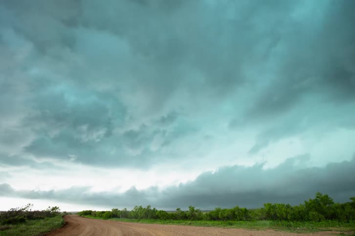 Time lapse of storm clouds passing over and over whelming the camera during a bad weather day in rural Texas