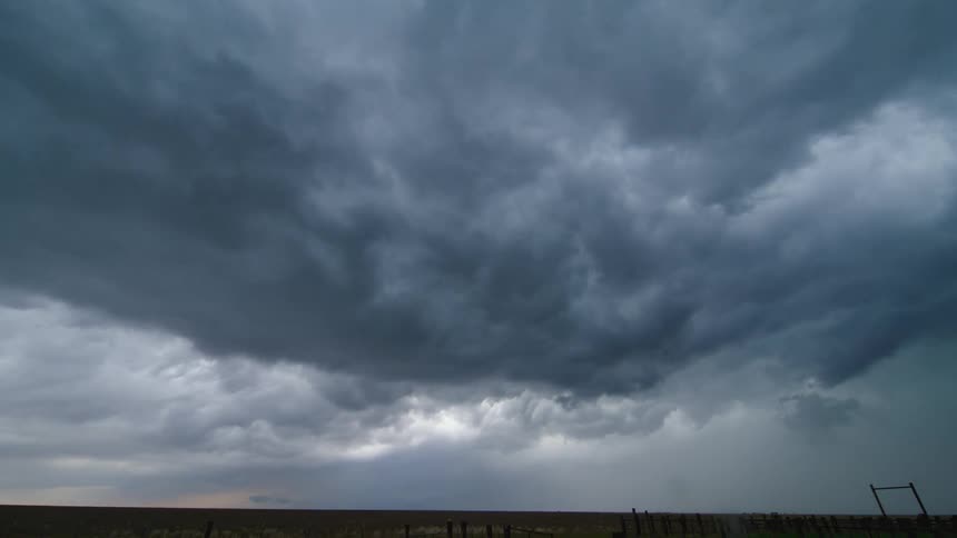 Time lapse of a severe weather system roiling and boiling in the sky as a severe thunderstorm overwhelms a rural Texas landscaper
