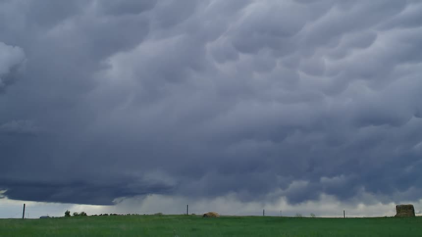 Time lapse of waves of mammatus clouds in rural Nebraska as a massive severe weather storm system blows into the area capable of producing a tornado