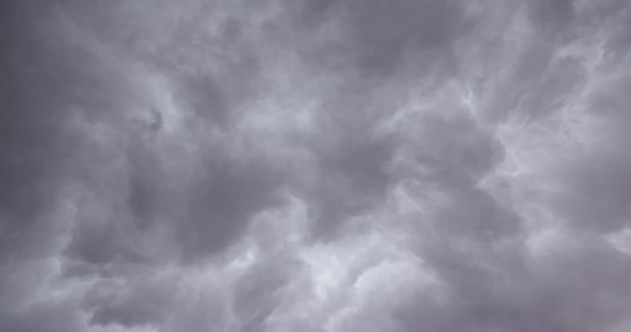 Time lapse looking straight up at boiling and tumbling clouds as the move in unstable air in a severe thunderstorm that resembles waves crashing underwater in the ocean