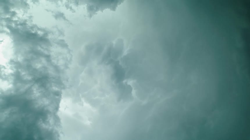 Time lapse looking straight up at an anvil severe weather supercell stom as it forms and churns mammatus clouds and boils