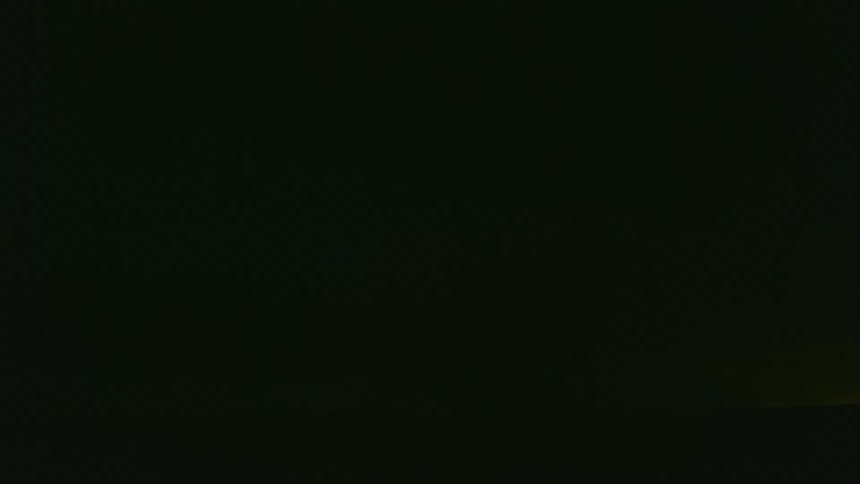 A night time lapse of a severe supercell thunderstorm of ominous dark clouds and hundreds of blinding flashes of lightning