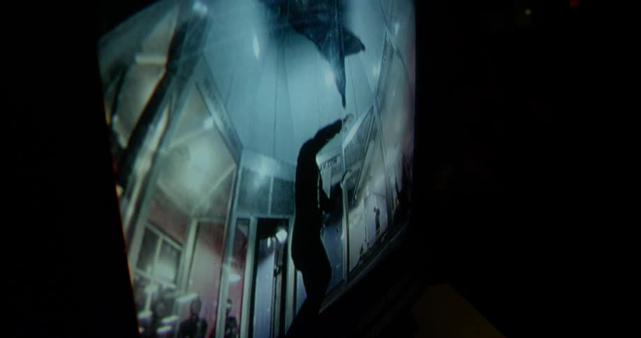 A person floating inside an indoor skydiving wind tunnel