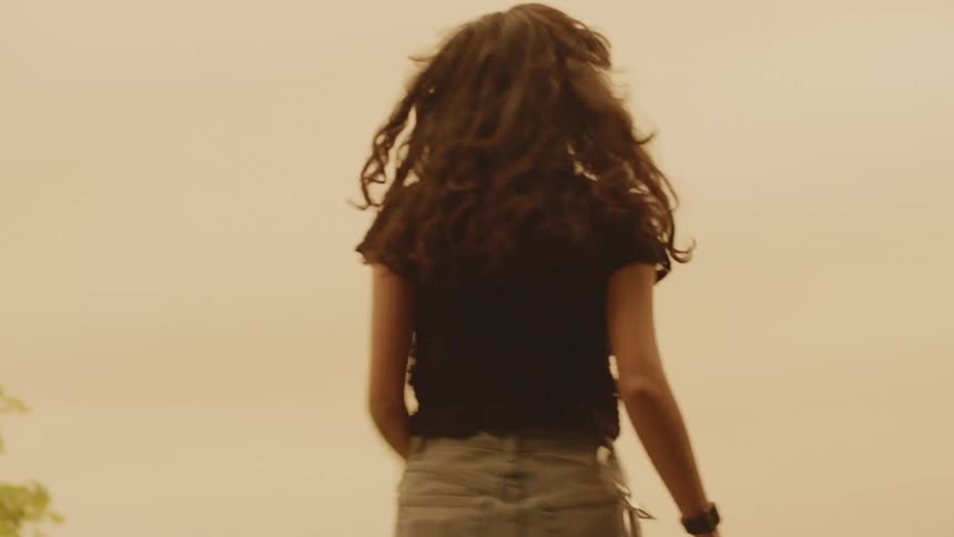 A woman is running outdoors in spring