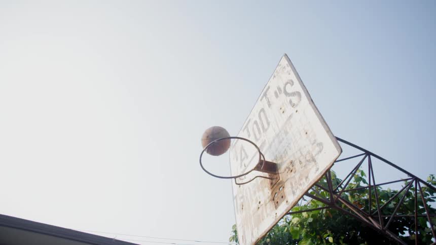 Basketball bouncing off the rim of a basketball hoop