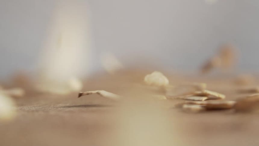 Wood chips falling on to a table