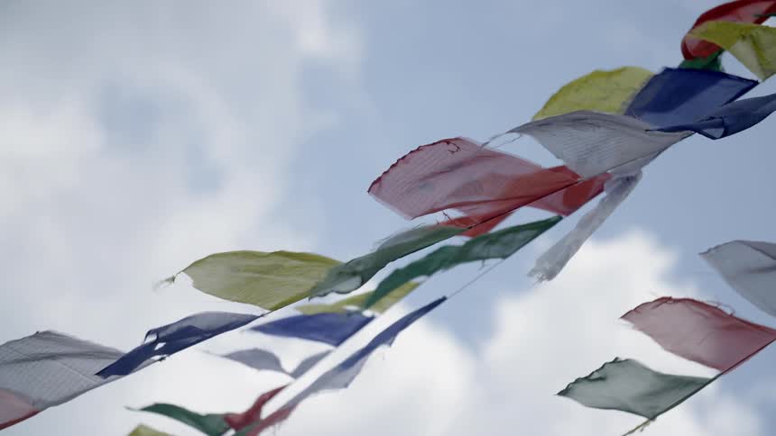 Tattered flags flutter in the breeze