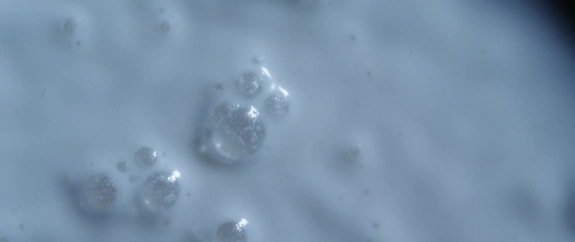 White black and gray colors that look like milk with bubbles gyrating