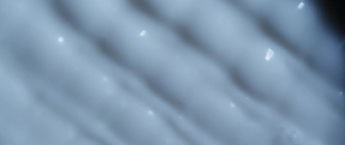 White liquid is moving in bands