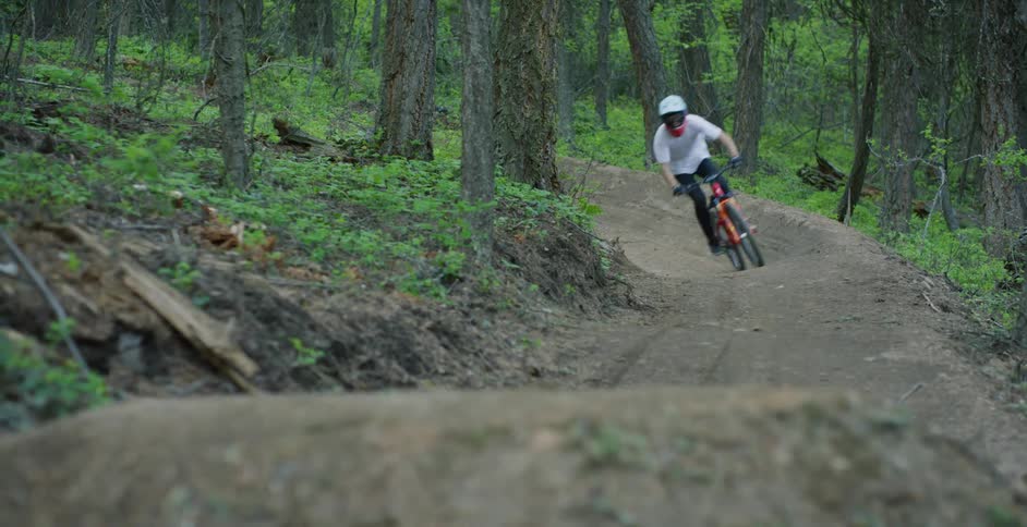 A man is riding on a dirt bike