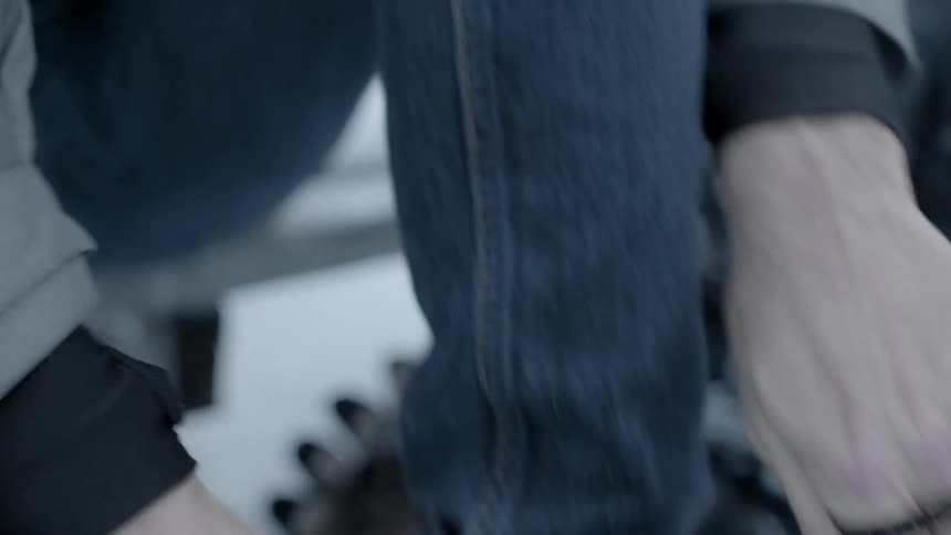 Close up of someone tying skates on their feet