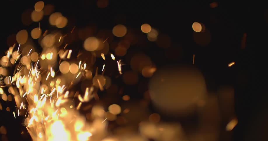 Firework sparkler crackling in the air at night