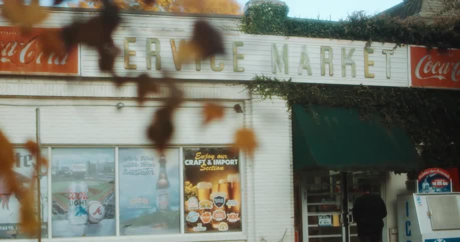 A person walks toward a stores doors