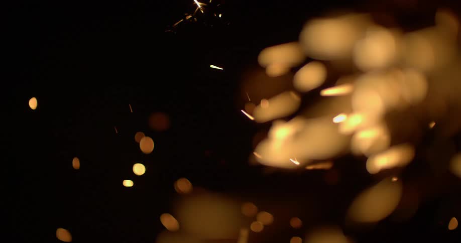 Dark background with embers and sparks