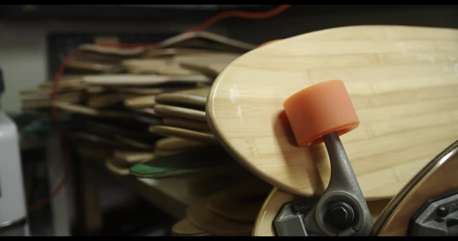 A skateboard is displayed indoors