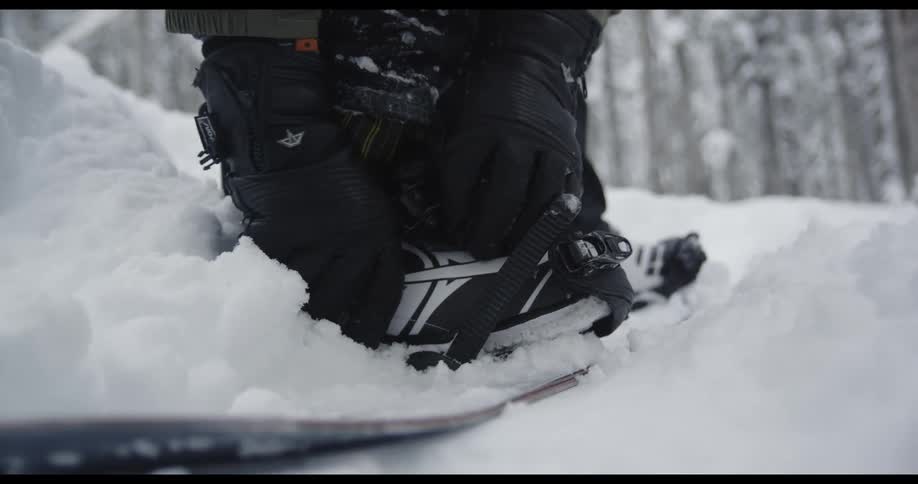 A person is snowboarding in winter