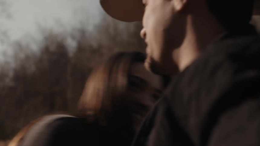 A man and woman are outdoors together