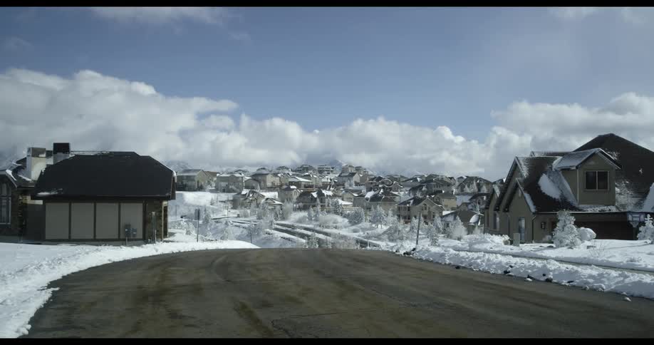 A neighborhood in winter is displayed