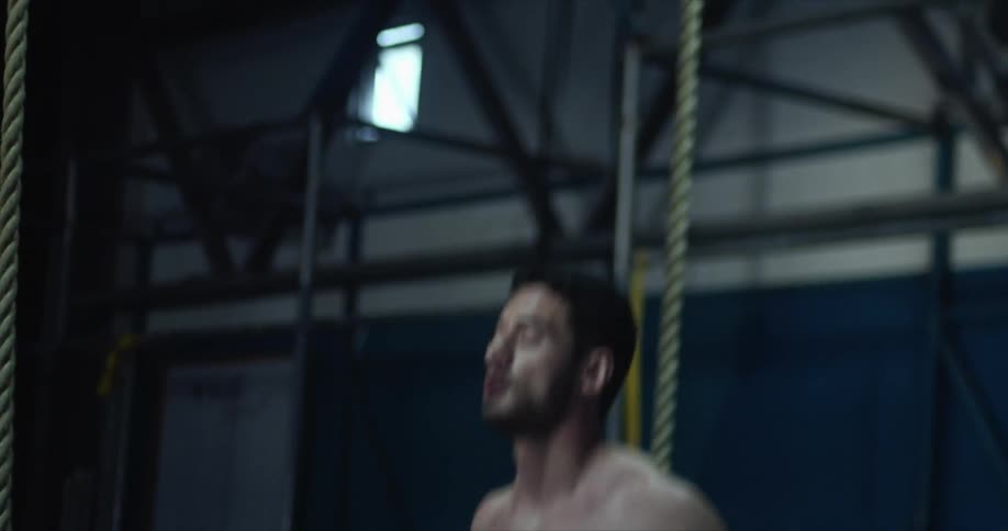 A man is exercising in a gym