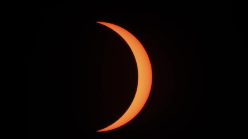 Partial solar eclipse where piece of the sun in still visible