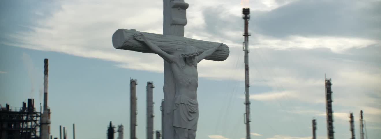 Wall separates factory from rows of religious masonry