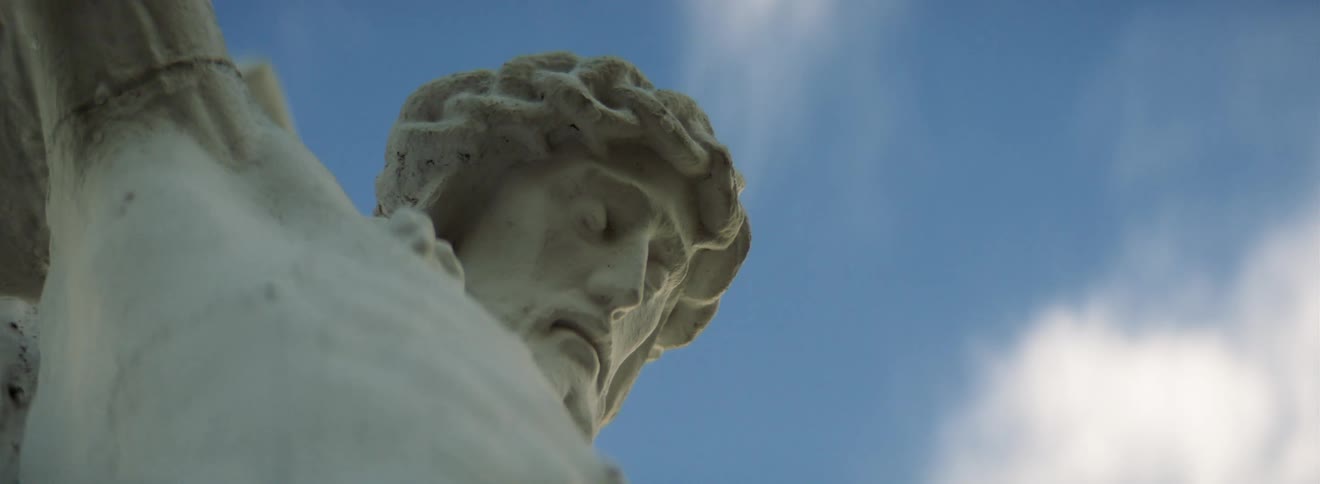A statue of a person is outdoors