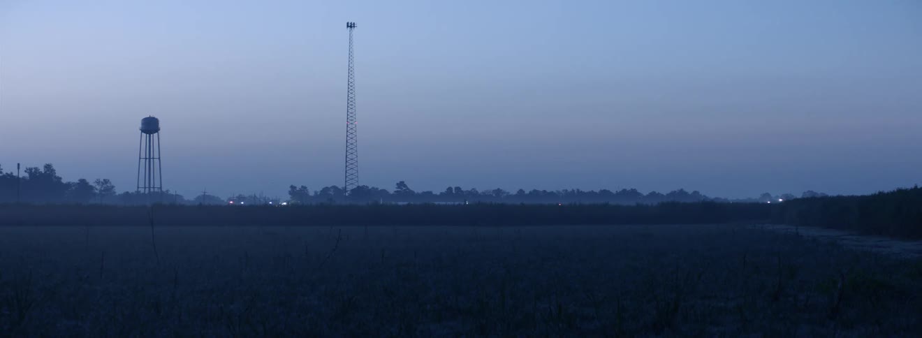 The sun is setting in a rural area