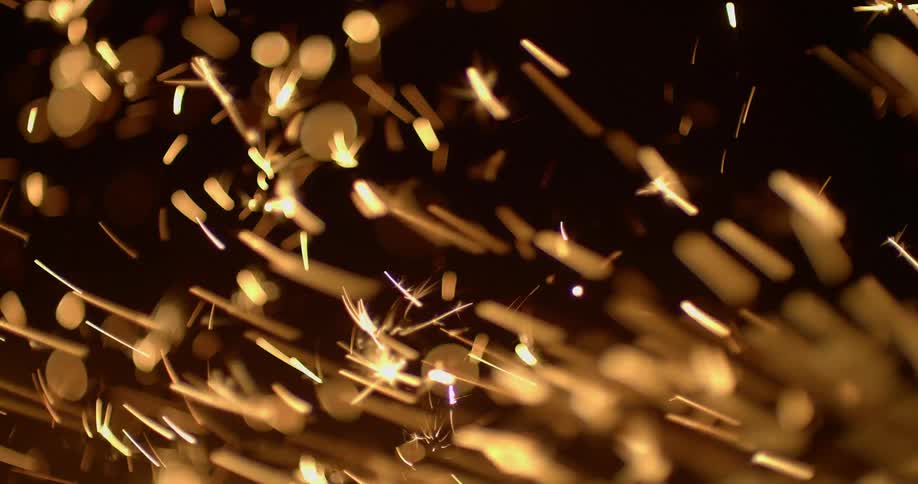 Yellow sparkler lights flickering in the night