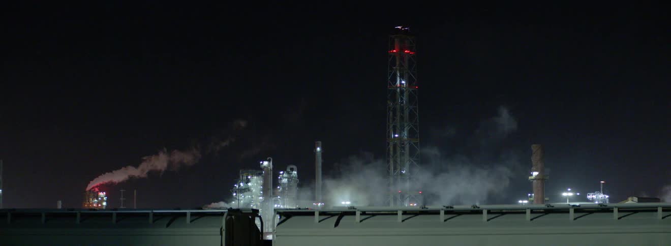A night shot of a group of factories