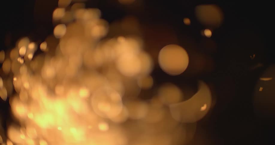 Flames and sparks outside at night