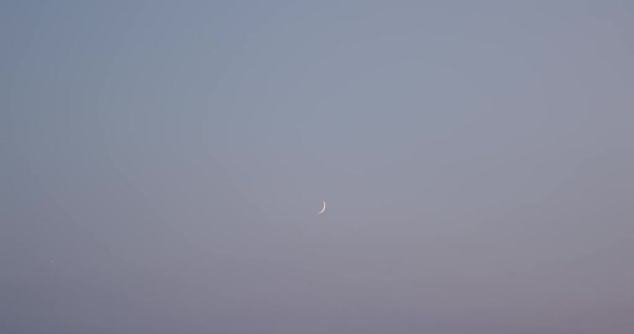 The moon is shown in the sky